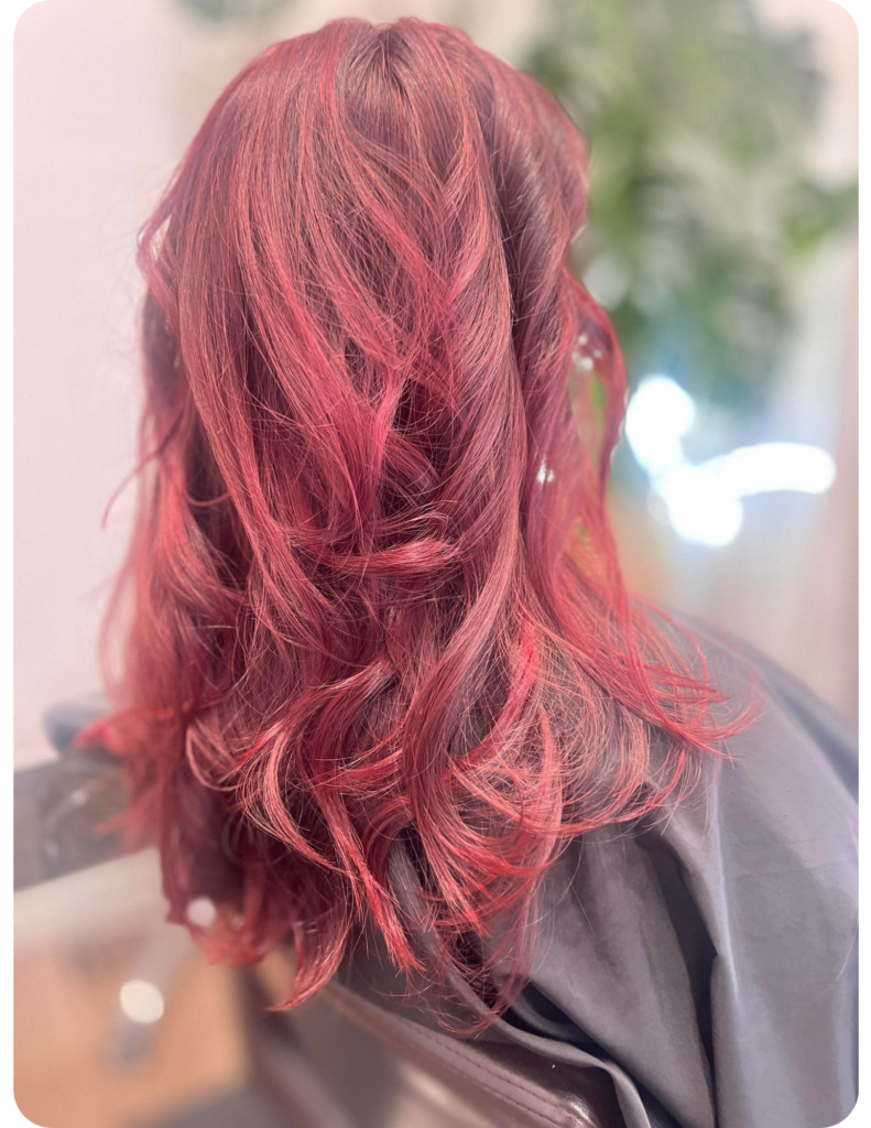 woman with long bright fuscia hair